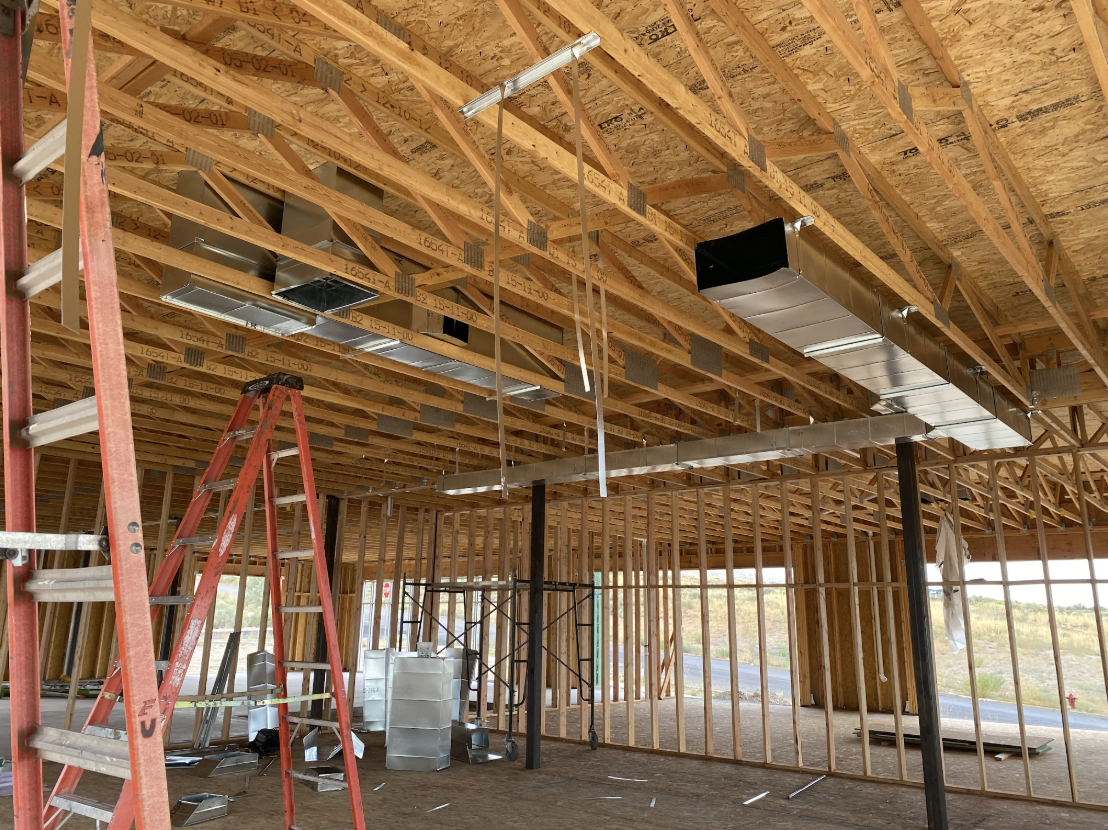 Custom galvanized ductwork installed in a building under construction