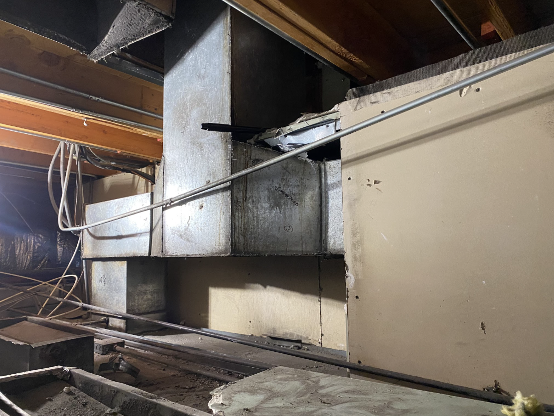 Galvanized grease duct and commercial kitchen exhaust ductwork in a mechanical space