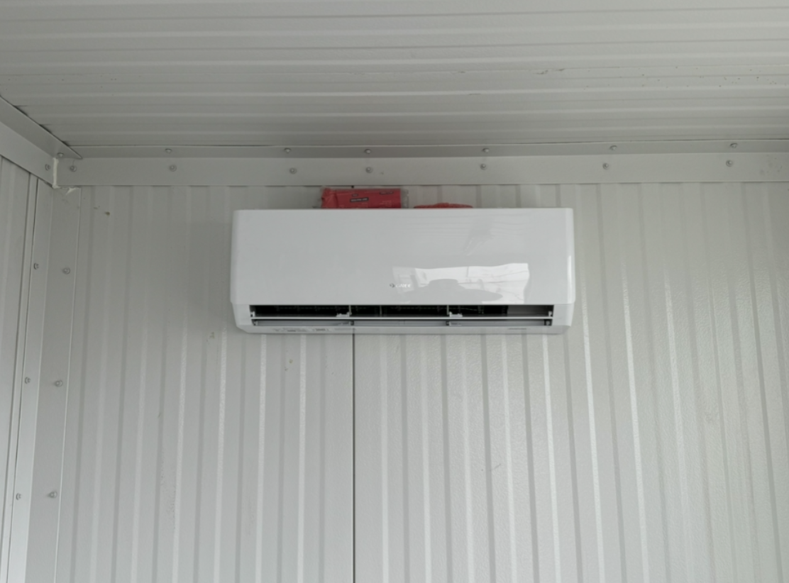 Wall-mounted ductless mini-split installed in a finished basement space